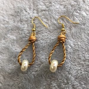 Golden Grass earrings with faux pearls and leather detail.